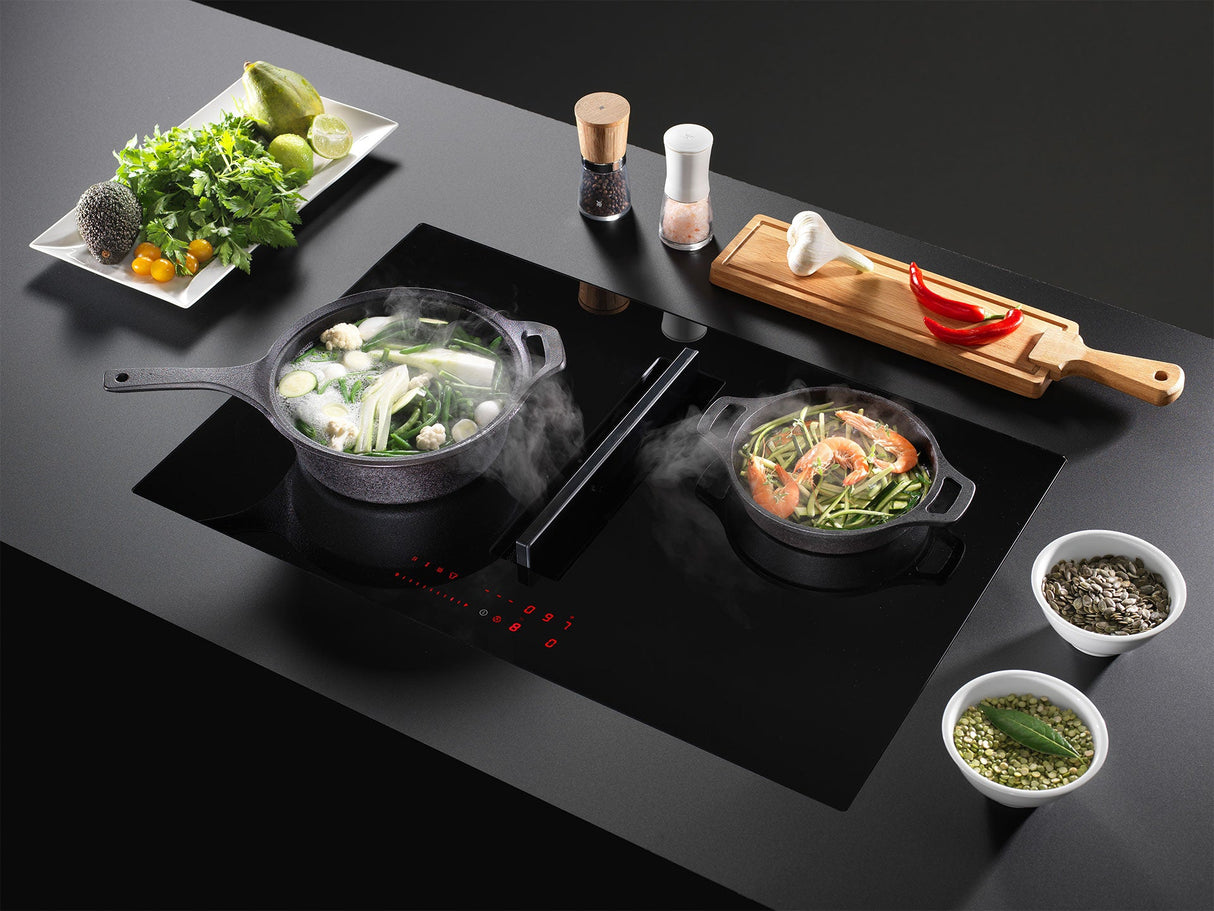Wave inductiekookplaat met afzuiging, ideaal voor het bereiden van groenten en gerechten met stoom.